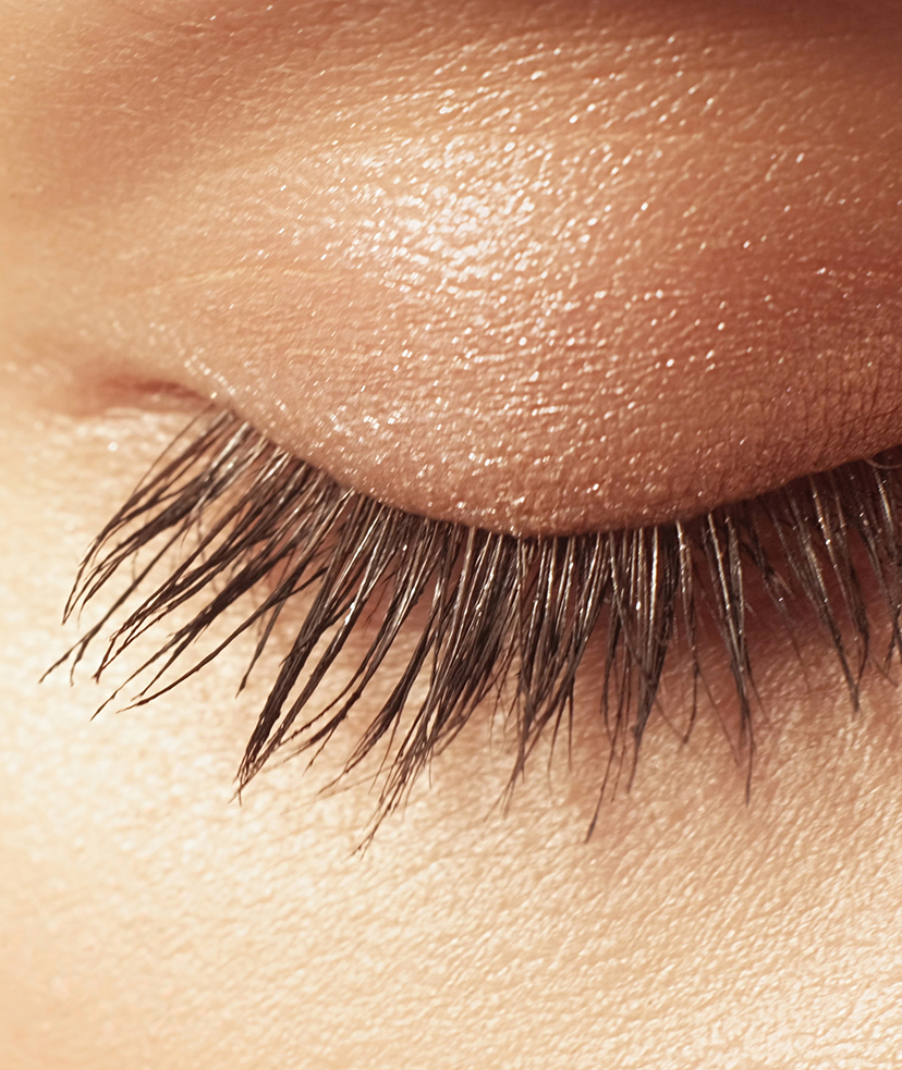 Photo of a woman's closed eye with long lashes