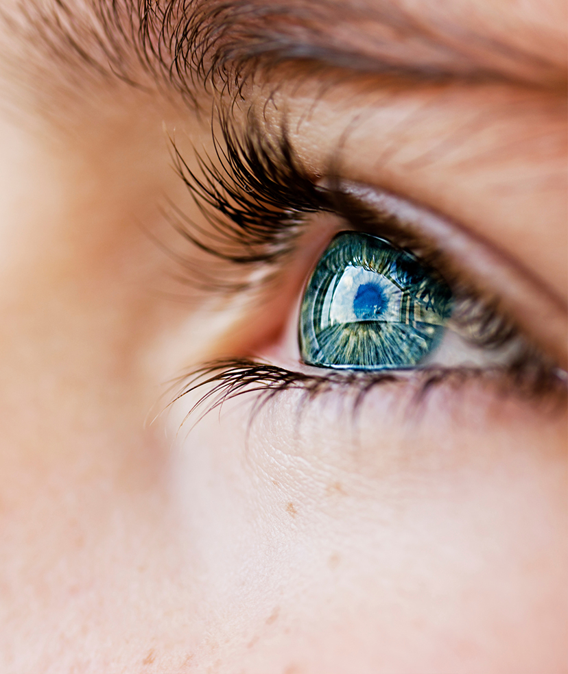 Photo of a woman's blueish-green eye