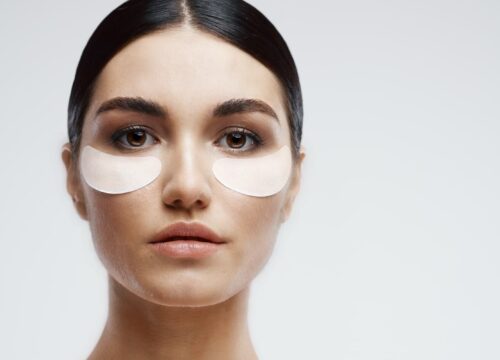 Photo of a woman with face pads under her eyes